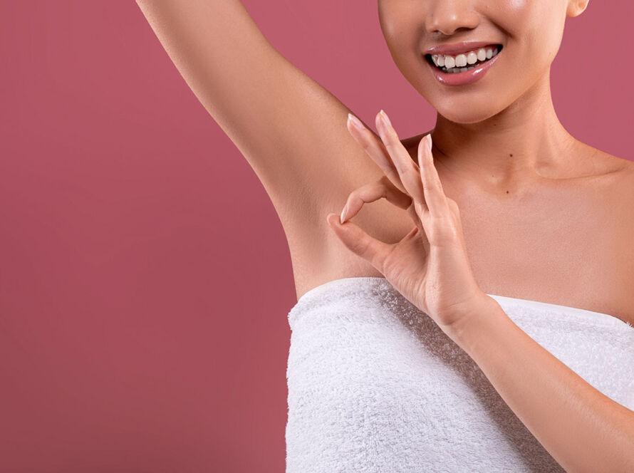 Asian woman lifting hand up, showing clean and hygienic armpits image